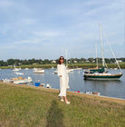 Side view of The Amy Caftan by Sara Khatib Design showing the bell sleeve trim and side slit of the maxi ladies caftan 