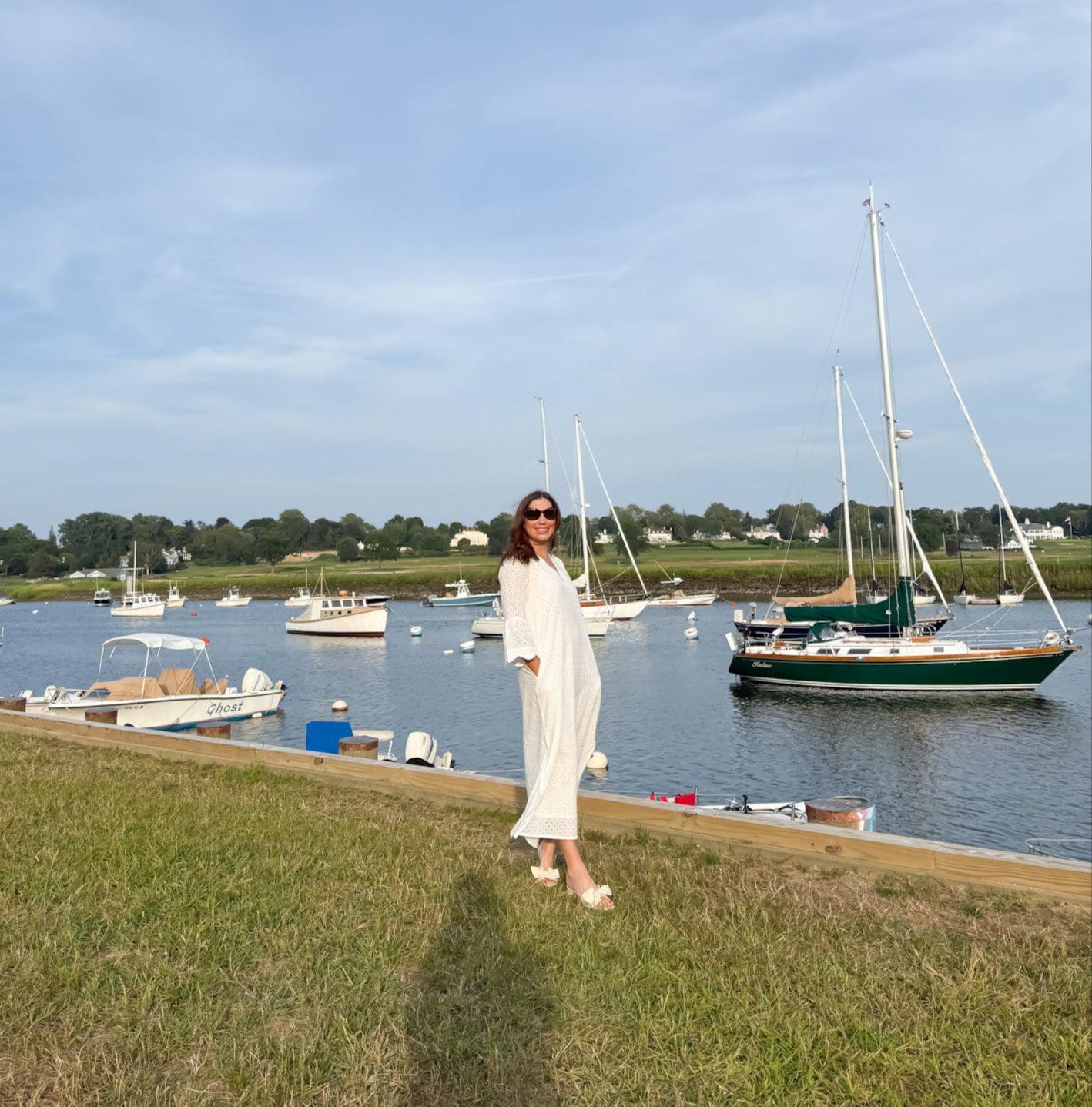 Side view of The Amy Caftan by Sara Khatib Design showing the bell sleeve trim and side slit of the maxi ladies caftan 