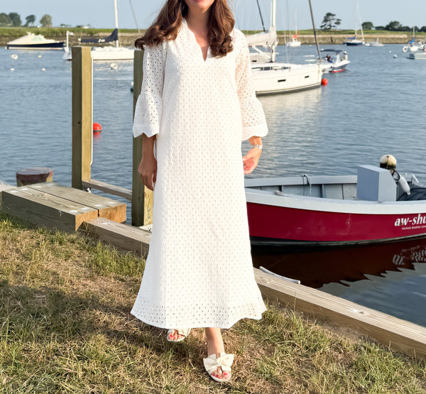The Amy Caftan by Sara Khatib Design a flattering maxi length caftan in  off white eyelet with bell sleeves and scalloped trim neckline with open side slits